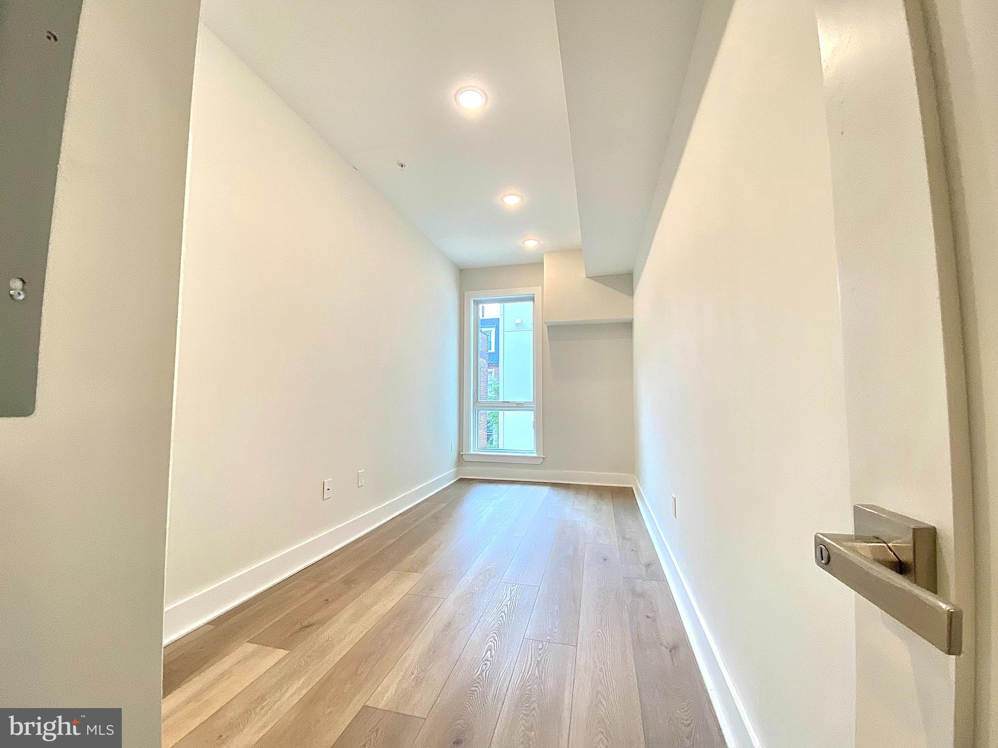 2216 Walnut Street, Unit 401 Philadelphia, PA 19103 - Photo 13 of 20 a view of hallway with wooden floor