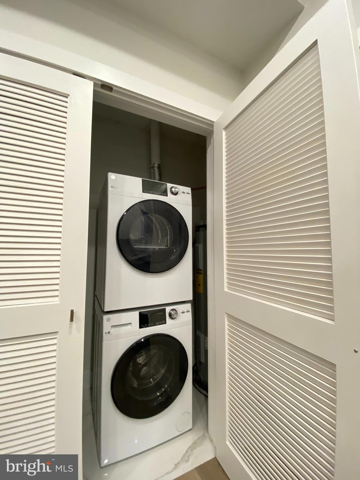 2216 Walnut Street, Unit 401 Philadelphia, PA 19103 - Photo 6 of 20 a utility room with dryer and washer