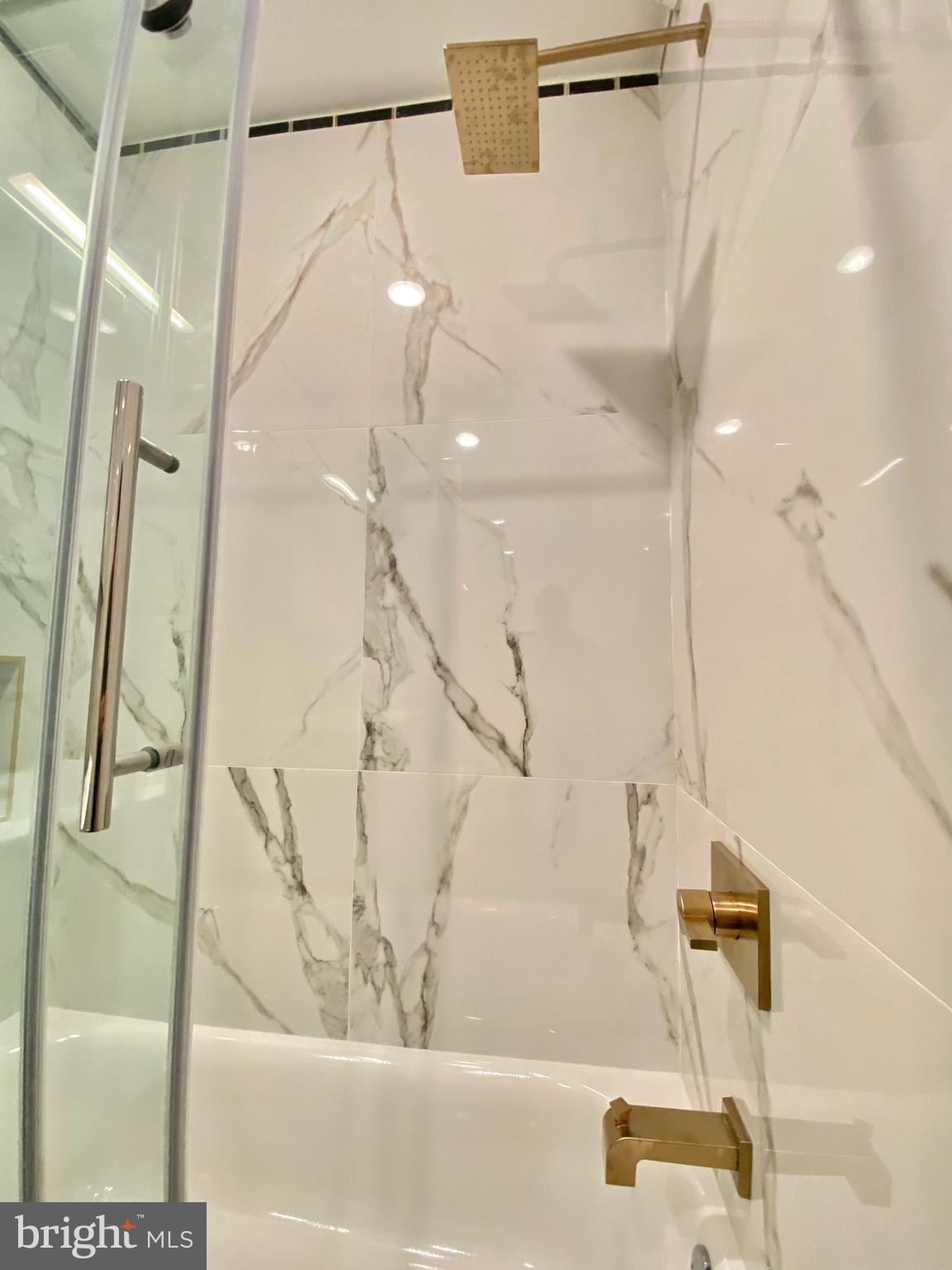 2216 Walnut Street, Unit 401 Philadelphia, PA 19103 - Photo 9 of 20 a bathroom with a bathtub and a shower