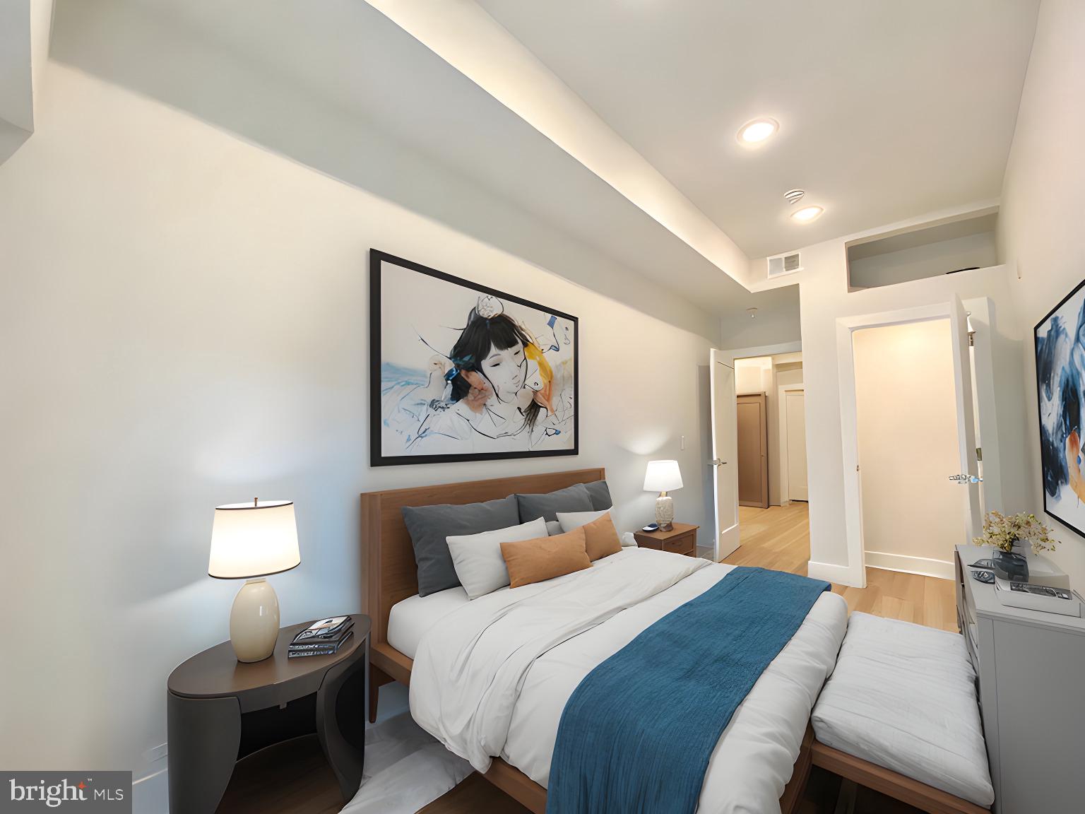 2216 Walnut Street, Unit 401 Philadelphia, PA 19103 - Photo 10 of 20 a bedroom with a bed and a flat screen tv