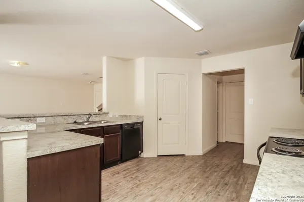 a spacious bathroom with a sink and a mirror