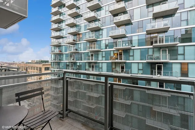 a room with a bookshelf and a chair