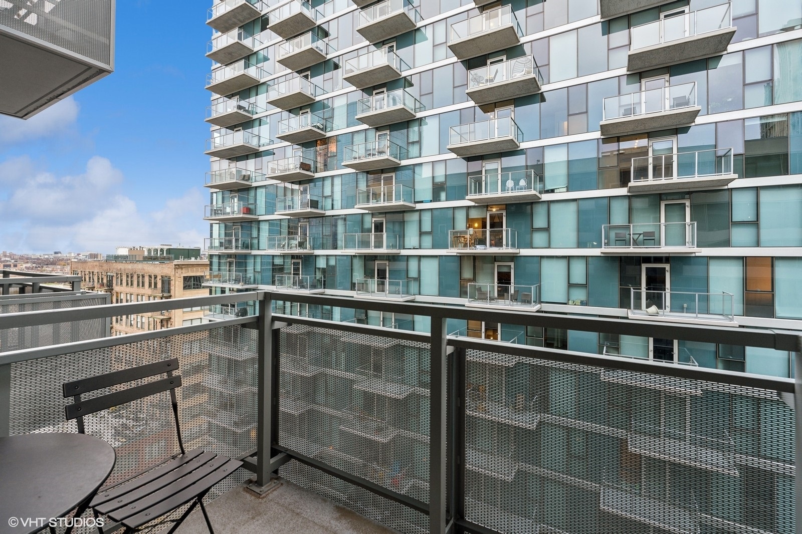 1345 South Wabash Avenue, Unit 1408 Chicago, IL 60605 - Photo 11 of 13 a room with a bookshelf and a chair