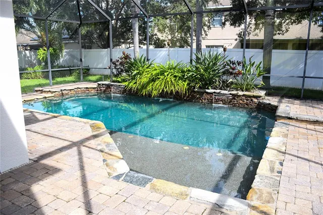 a view of a swimming pool with a patio
