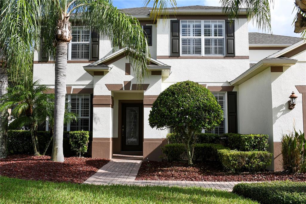 557 Palio Court Ocoee, FL 34761 - Photo 2 of 18 a front view of a house with a yard