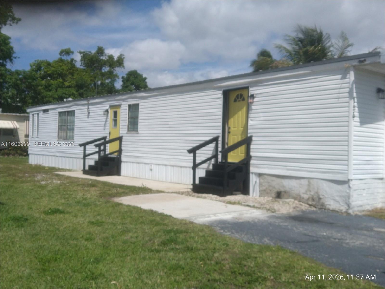 35250 Southwest 177th Court, Unit 136 Homestead, FL 33034 - Photo 1 of 23 a view of a back yard of the house