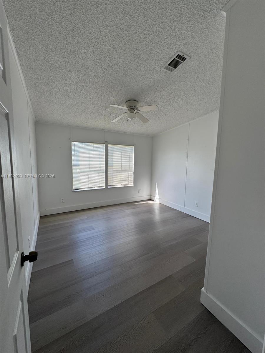 35250 Southwest 177th Court, Unit 136 Homestead, FL 33034 - Photo 12 of 23 an empty room with windows