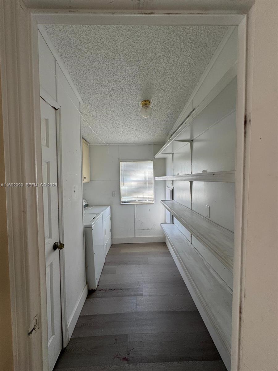 35250 Southwest 177th Court, Unit 136 Homestead, FL 33034 - Photo 19 of 23 a room with white cabinets and white walls
