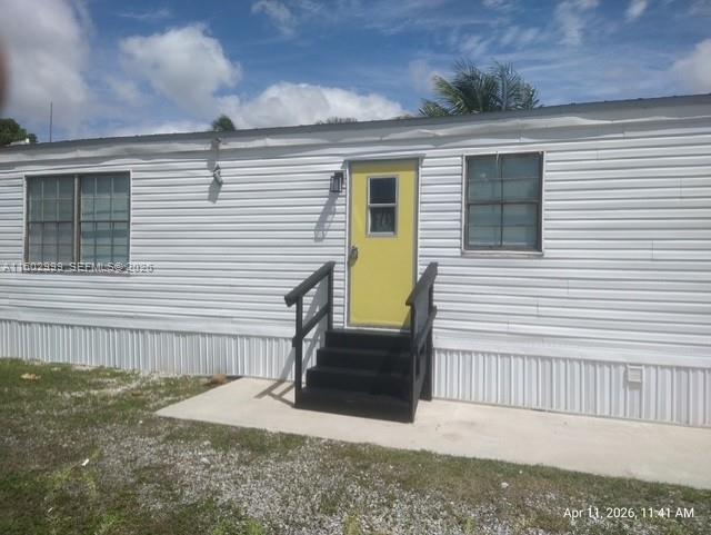 35250 Southwest 177th Court, Unit 136 Homestead, FL 33034 - Photo 2 of 23 a view of a house with a patio