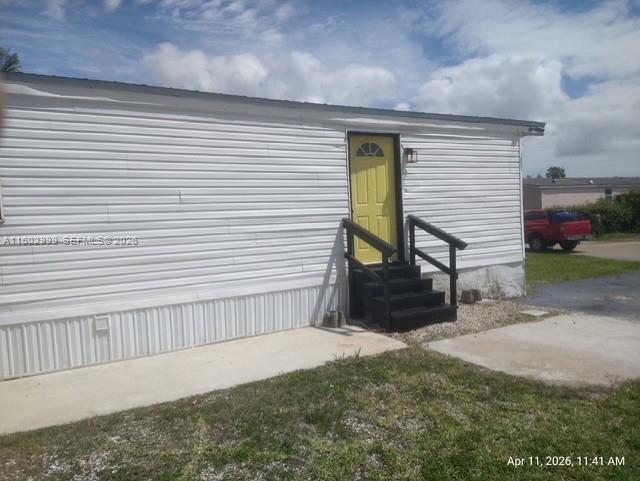 35250 Southwest 177th Court, Unit 136 Homestead, FL 33034 - Photo 23 of 23 a view of backyard with a small cabin