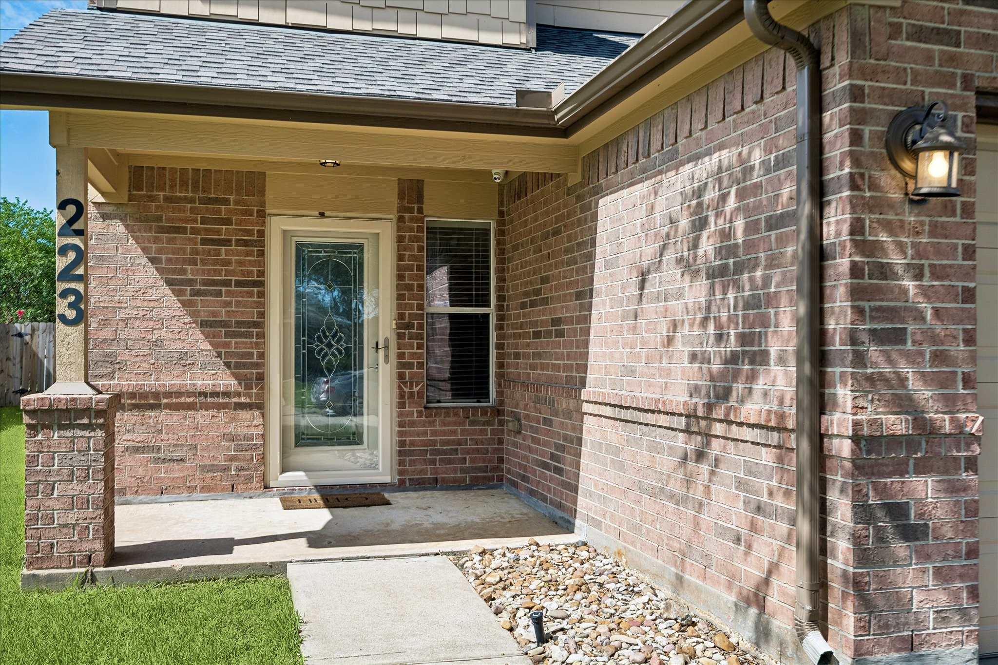 223 Sunset Colony Drive Rosharon, TX 77583 - Photo 4 of 50 A covered front porch, energy-efficient storm door and leaded-glass front door create a warm first impression, offering just a hint of the fresh finishes, comfortable spaces and easygoing style waiting inside.