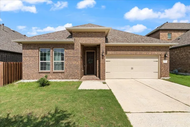 a kitchen with refrigerator and cabinets