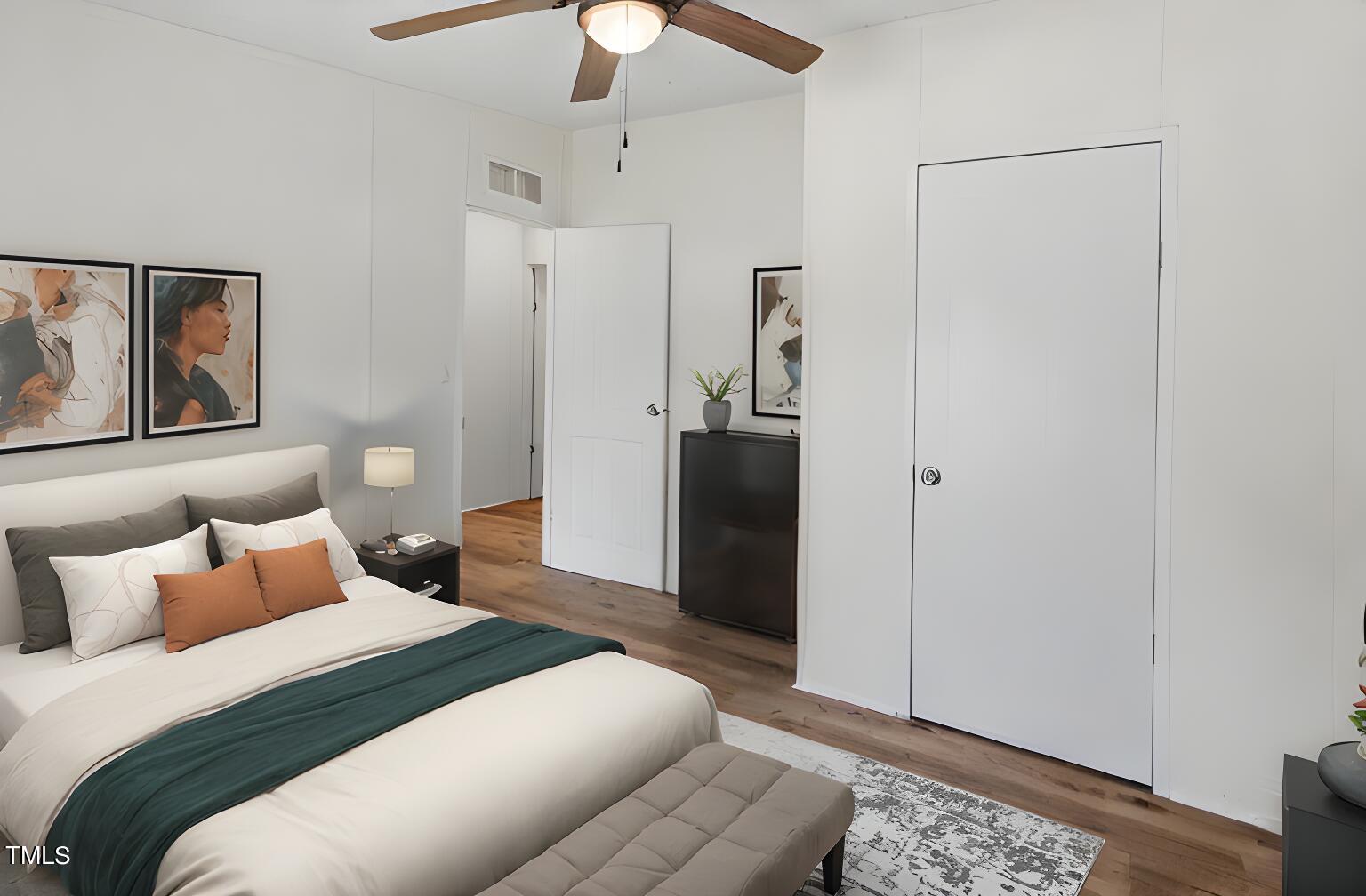 10335 West Old Spring Hope Road Spring Hope, NC 27882 - Photo 13 of 20 a bedroom with a bed and a chandelier