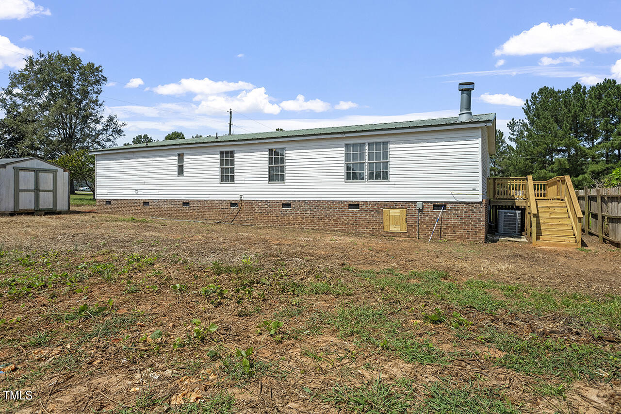 10335 West Old Spring Hope Road Spring Hope, NC 27882 - Photo 18 of 20 a view of a house with a yard