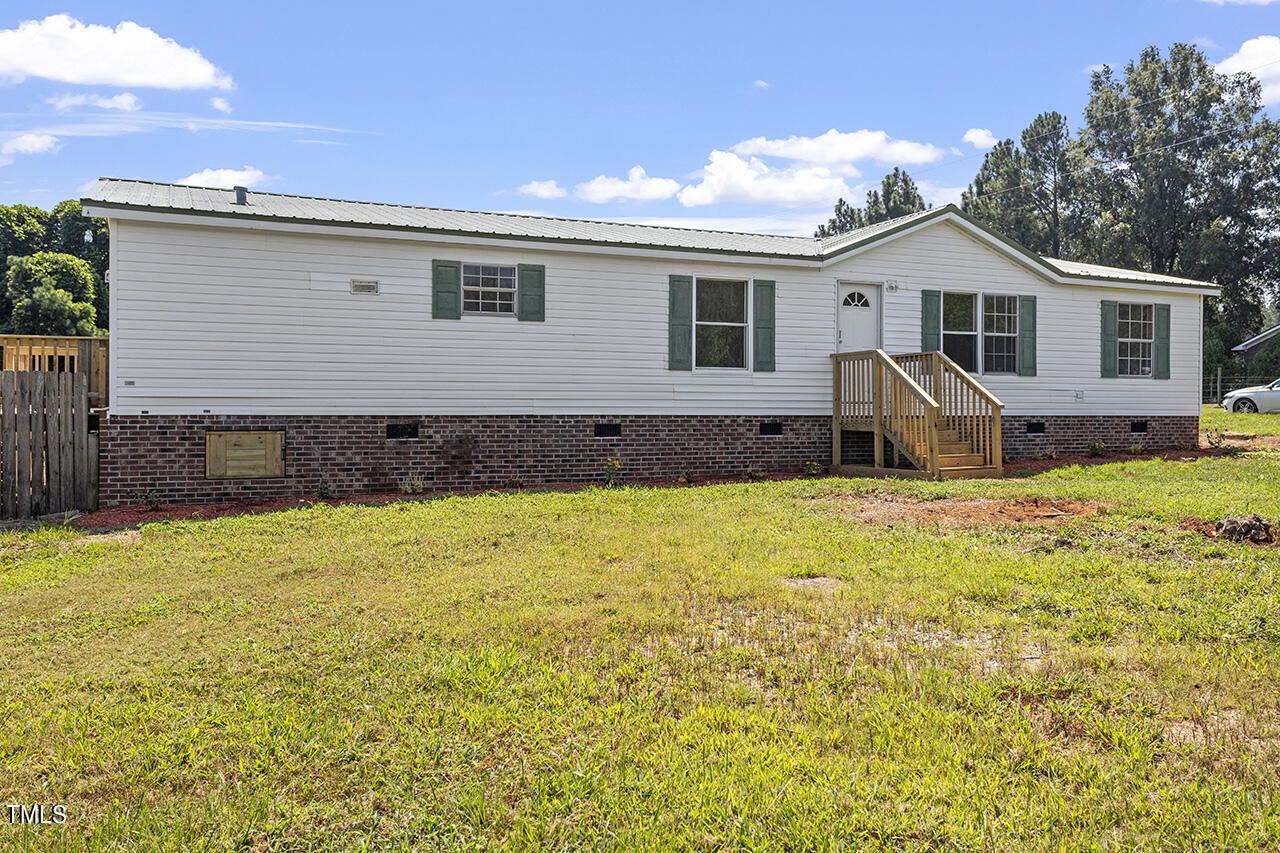 10335 West Old Spring Hope Road Spring Hope, NC 27882 - Photo 3 of 20 a front view of a house with a yard