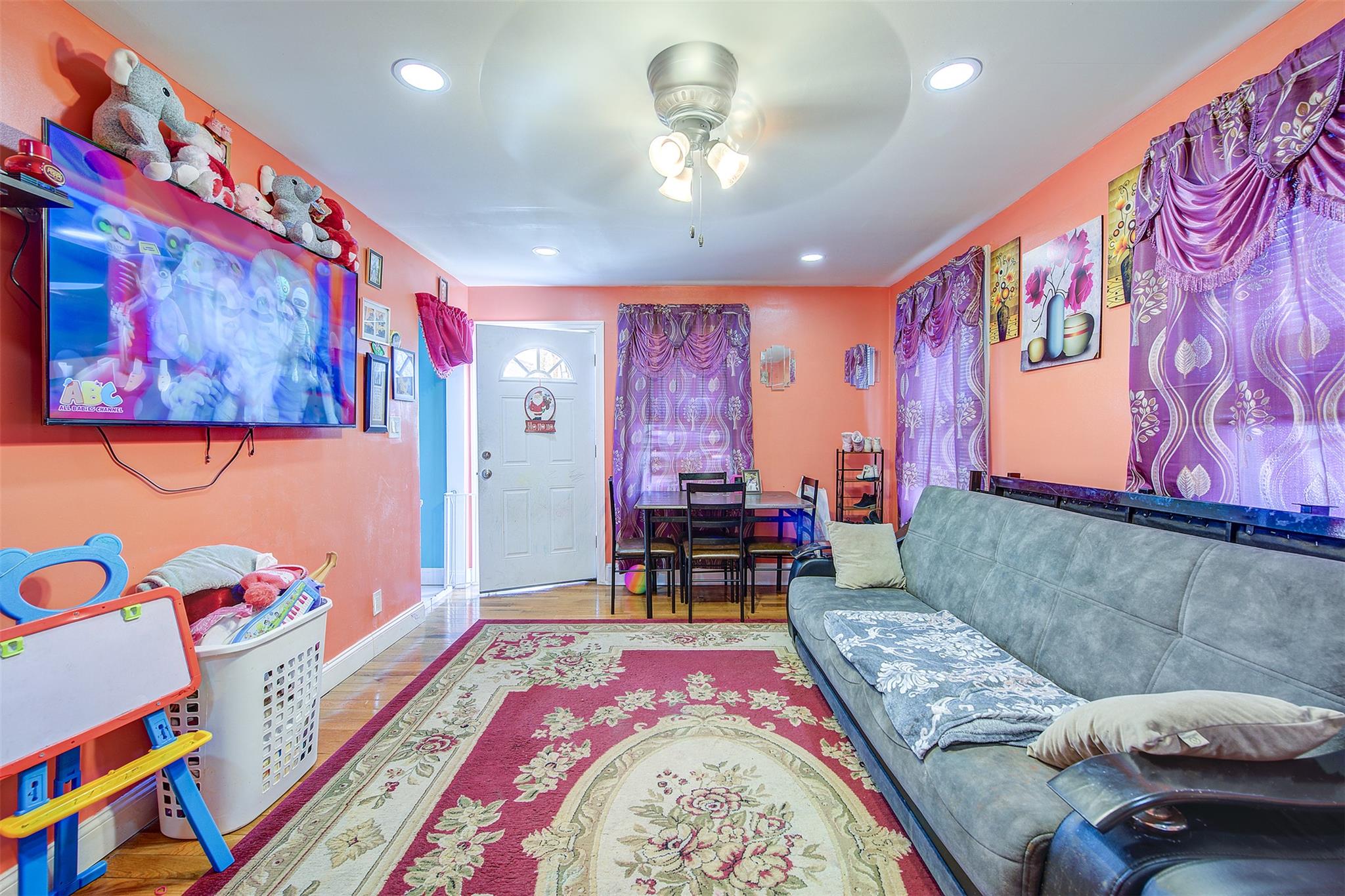 89-91 215th Place Queens, NY 11427 - Photo 16 of 16 Living area with recessed lighting, ceiling fan, baseboards, and wood finished floors