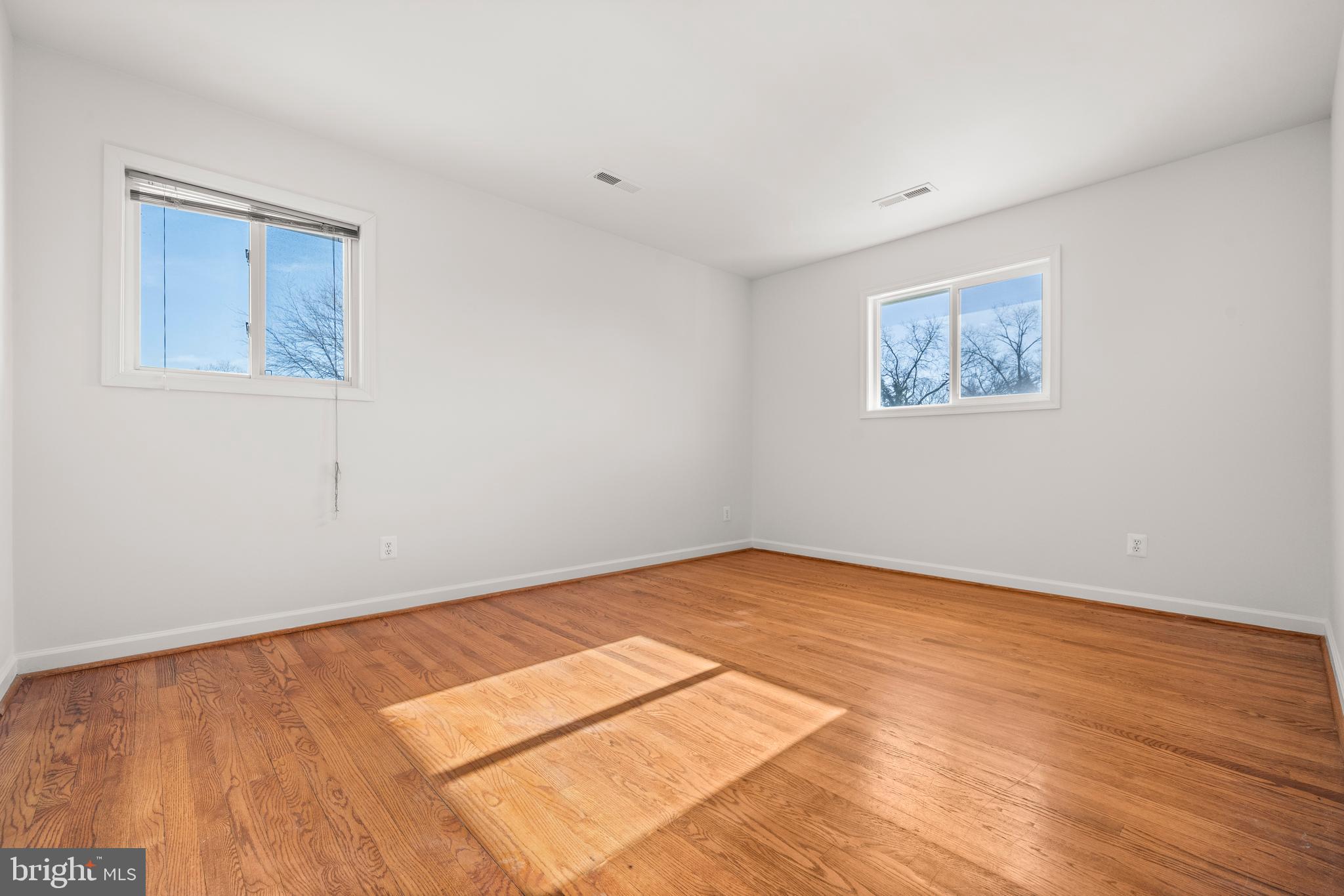 8100 Oxon Hill Road Fort Washington, MD 20744 - Photo 21 of 40 a view of an empty room with wooden floor