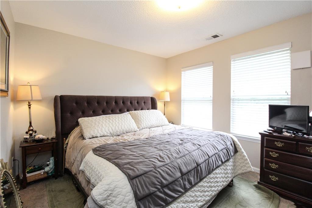 3620 Ginnis Road, Unit 4 Atlanta, GA 30331 - Photo 11 of 17 a bedroom with a bed and a tv