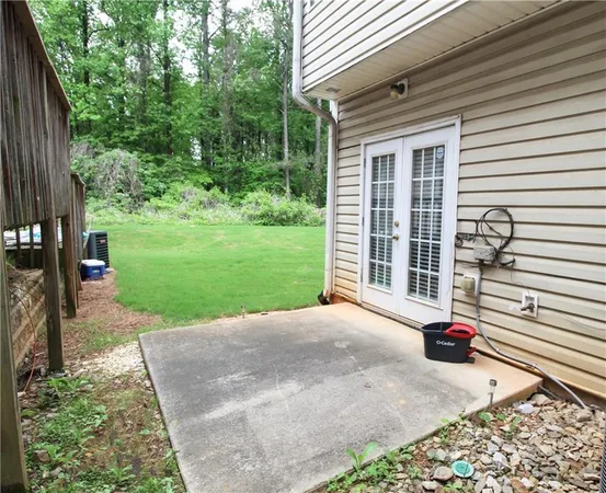 a view of a backyard with sitting area