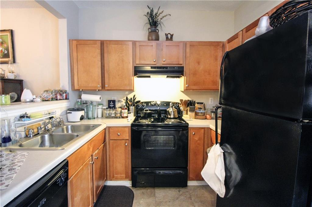 3620 Ginnis Road, Unit 4 Atlanta, GA 30331 - Photo 5 of 17 a kitchen with a refrigerator stove and a sink