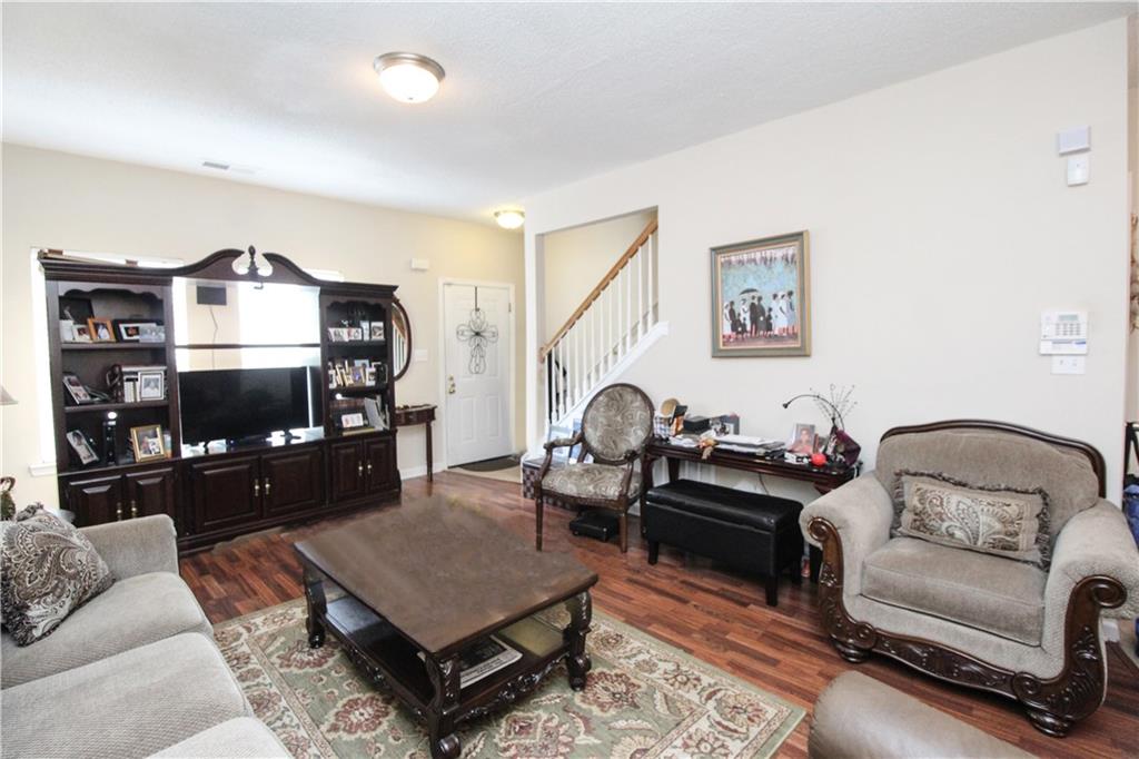 3620 Ginnis Road, Unit 4 Atlanta, GA 30331 - Photo 6 of 17 a living room with furniture and a flat screen tv