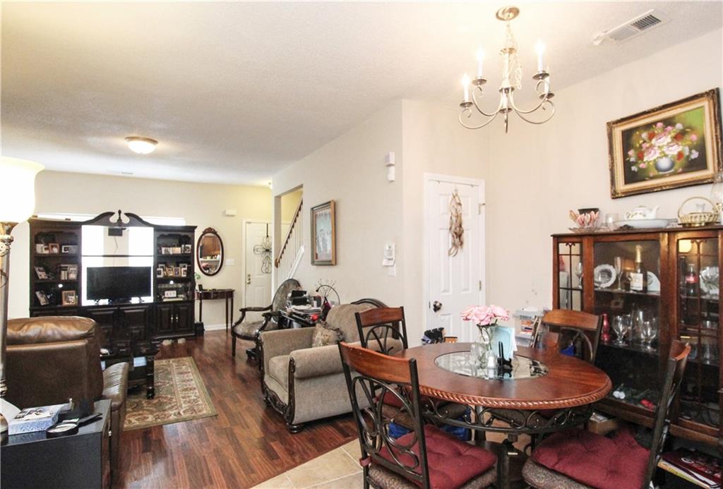 3620 Ginnis Road, Unit 4 Atlanta, GA 30331 - Photo 7 of 17 a view of a dining room with furniture and wooden floor