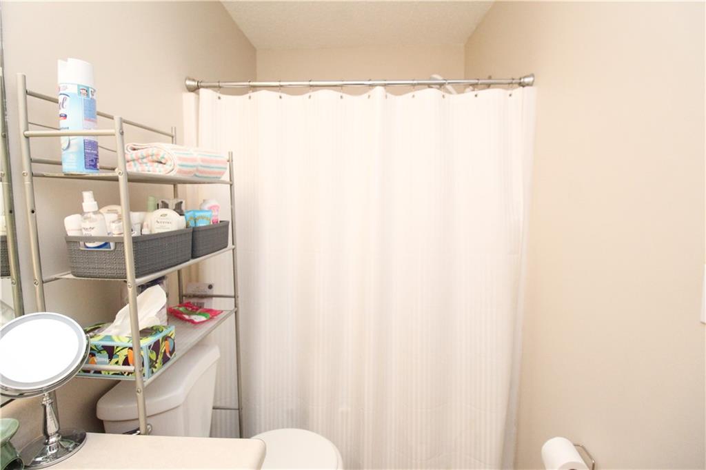 3620 Ginnis Road, Unit 4 Atlanta, GA 30331 - Photo 9 of 17 a bathroom with a sink toilet and shower