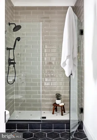 a bathroom with a sink and a shower