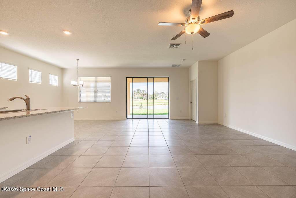 1863 Farmhouse Road Southeast Palm Bay, FL 32909 - Photo 16 of 44 a view of an empty room with a window