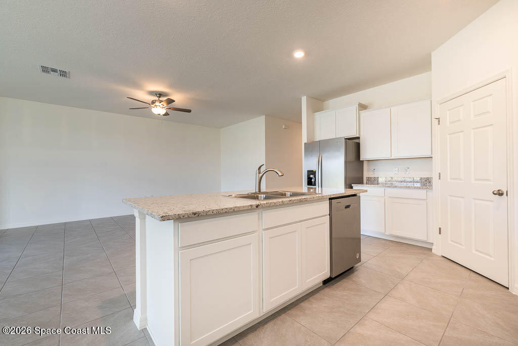 1863 Farmhouse Road Southeast Palm Bay, FL 32909 - Photo 18 of 44 a kitchen with a sink and cabinets