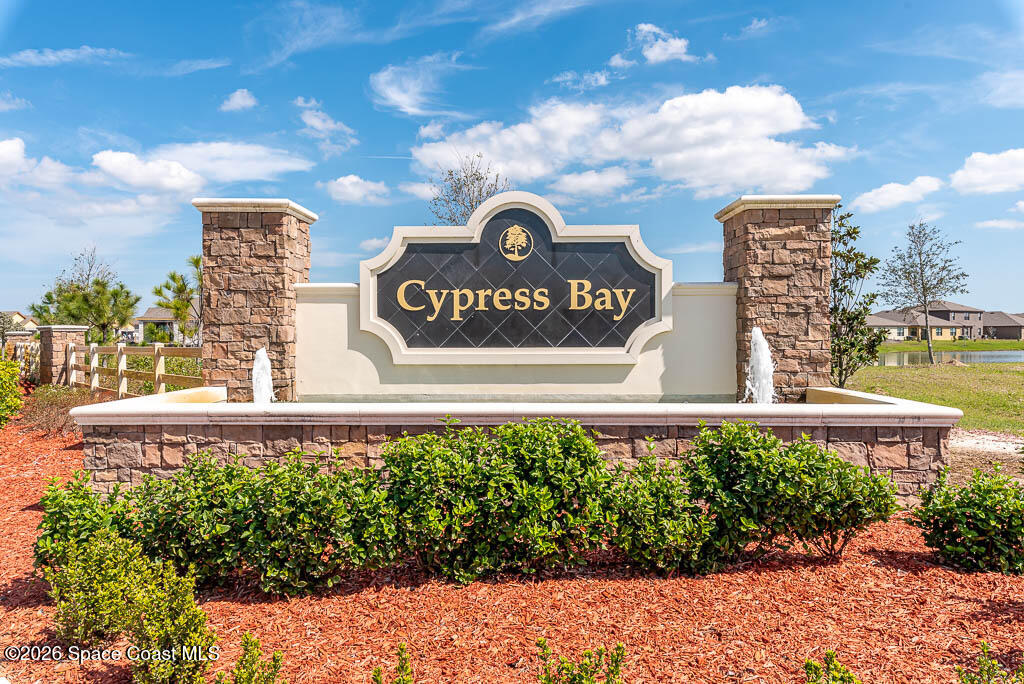 1863 Farmhouse Road Southeast Palm Bay, FL 32909 - Photo 2 of 44 a view of a sign board with buildings in the background