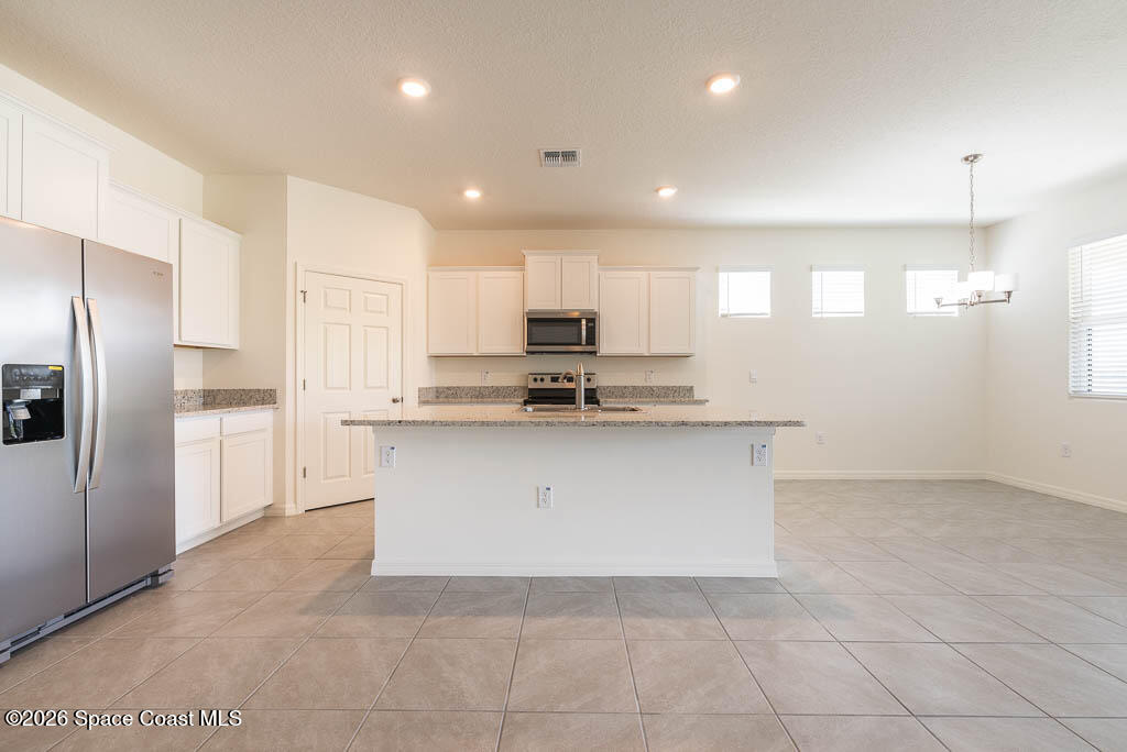 1863 Farmhouse Road Southeast Palm Bay, FL 32909 - Photo 21 of 44 a view of kitchen with stainless steel appliances cabinets