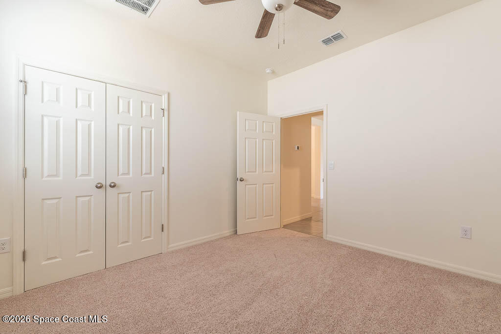 1863 Farmhouse Road Southeast Palm Bay, FL 32909 - Photo 22 of 44 an empty room with fan