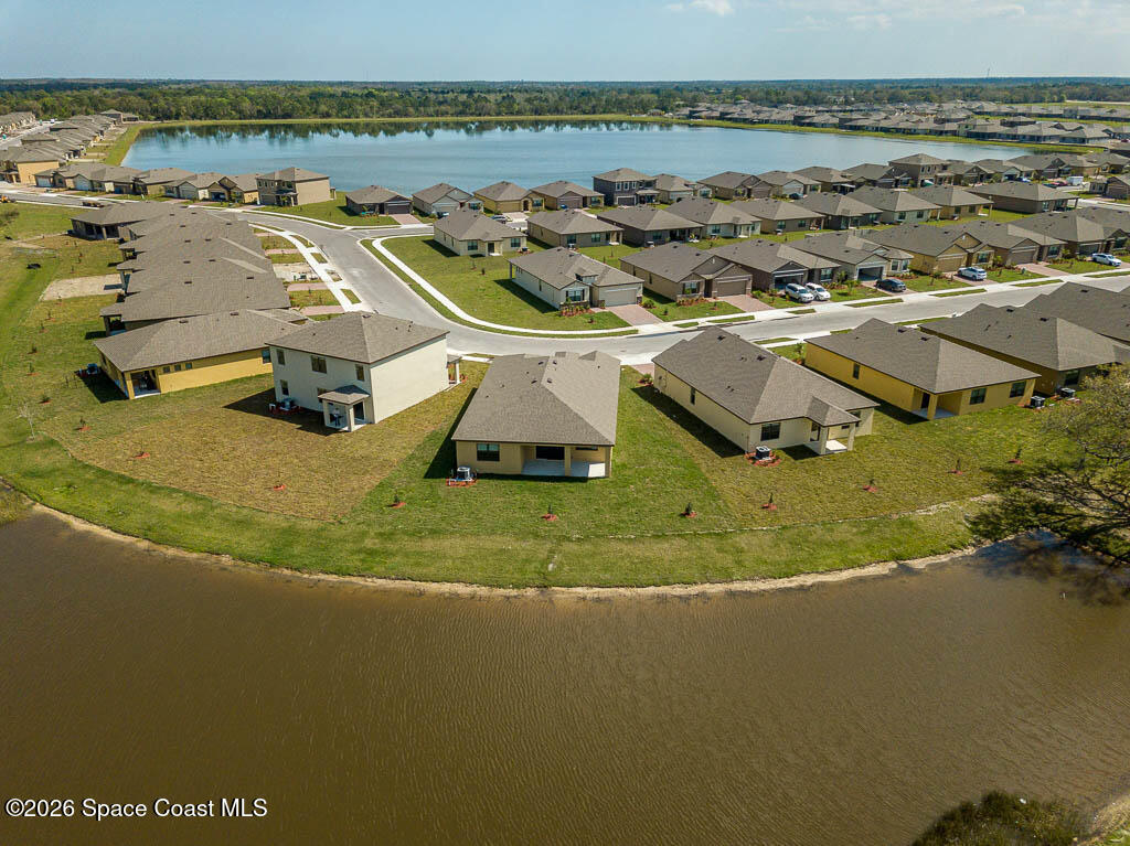 1863 Farmhouse Road Southeast Palm Bay, FL 32909 - Photo 32 of 44 an aerial view of residential houses with outdoor space