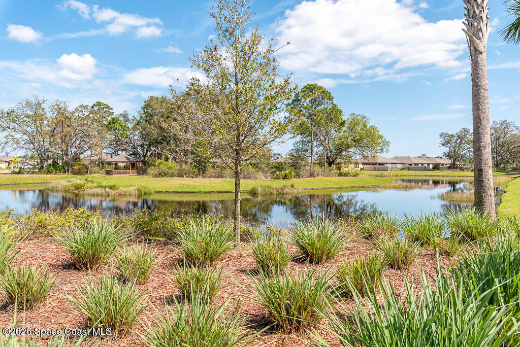 1863 Farmhouse Road Southeast Palm Bay, FL 32909 - Photo 42 of 44 a view of a lake with an outdoor space