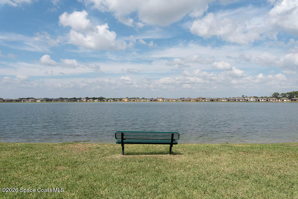 1863 Farmhouse Road Southeast Palm Bay, FL 32909 - Photo 43 of 44 a view of a lake from a yard