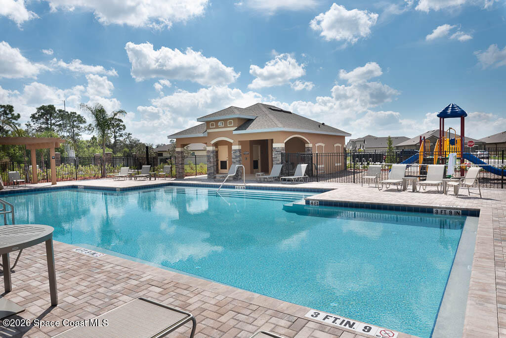1863 Farmhouse Road Southeast Palm Bay, FL 32909 - Photo 44 of 44 a view of a lake with houses
