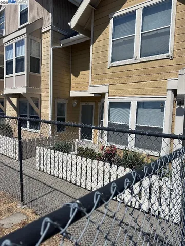 front view of a house with a bench