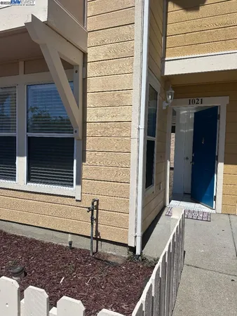a view of a house with a door and stairs