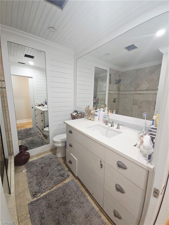 5321 Warren Street Naples, FL 34113 - Photo 12 of 21 a bathroom with a sink double vanity and a mirror