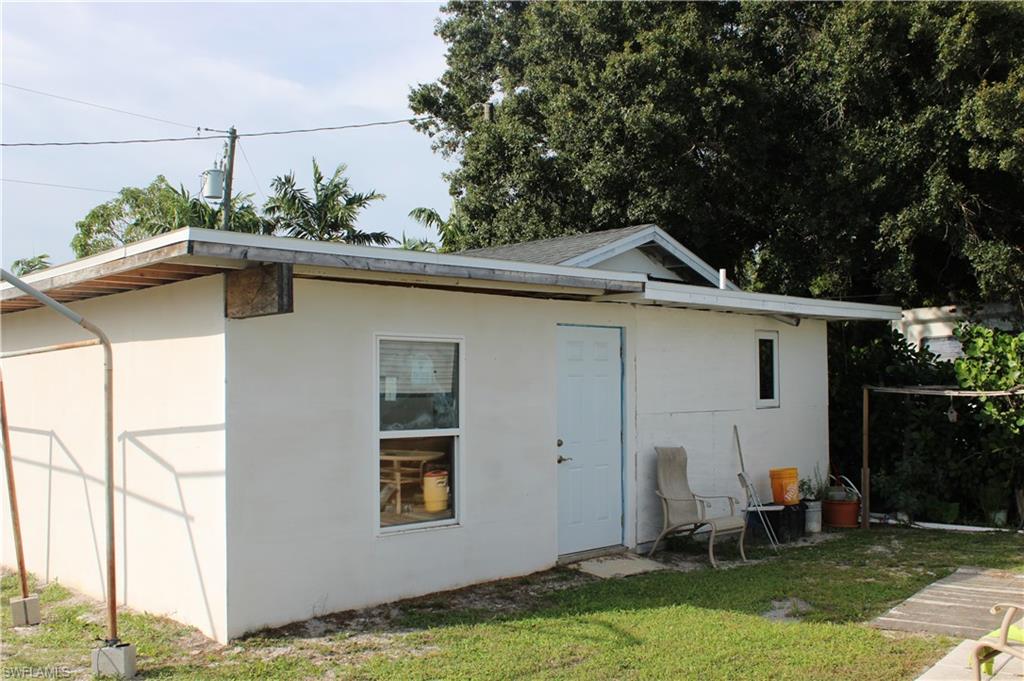 5321 Warren Street Naples, FL 34113 - Photo 26 of 26 a front view of house with yard