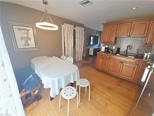 a bedroom with a bed and a sink