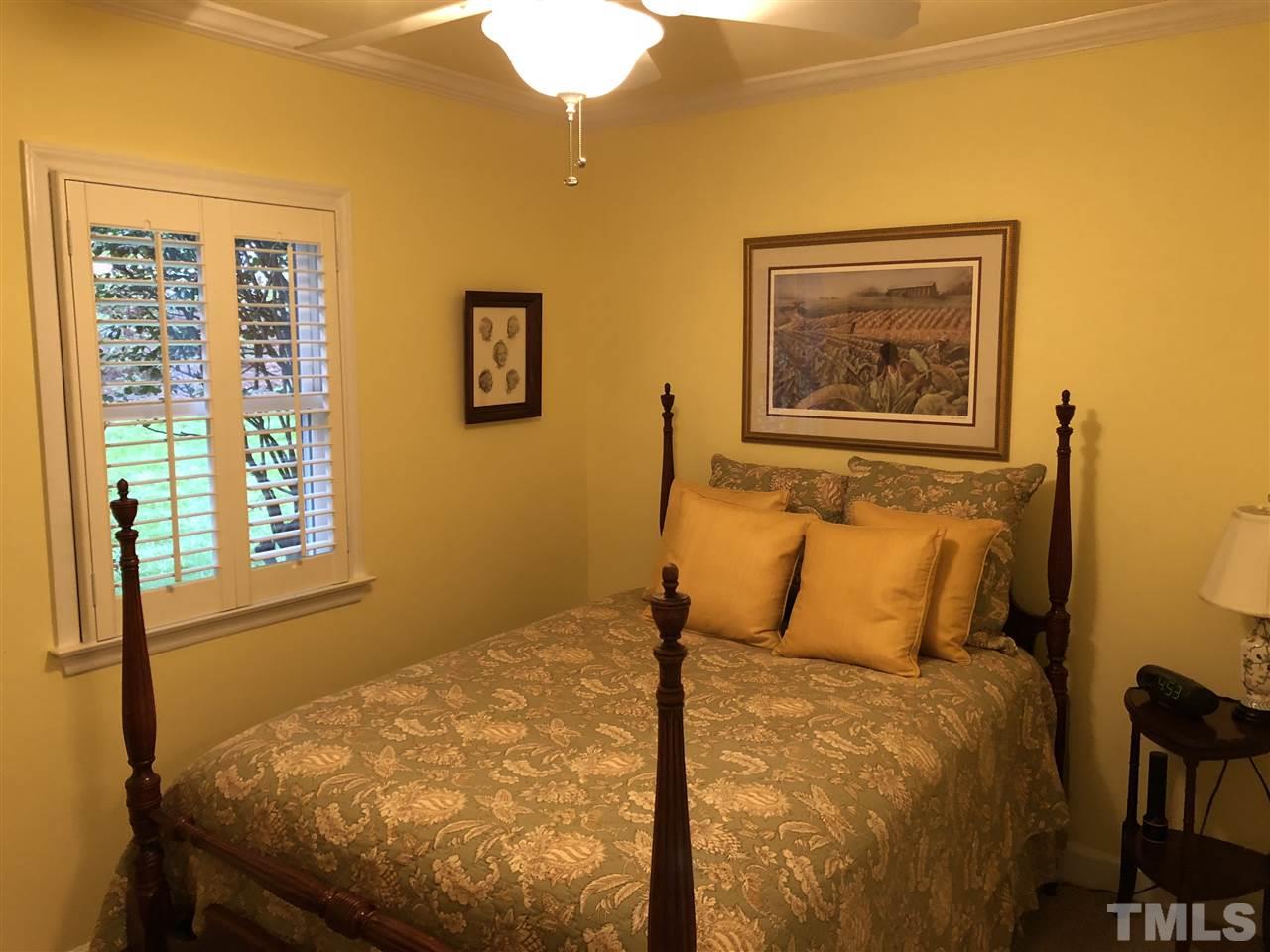 1115 Hunting Ridge Road Raleigh, NC 27615 - Photo 22 of 25 a bedroom with a bed and a window