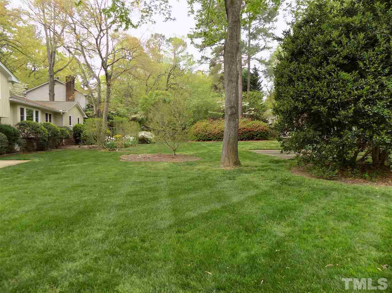 1115 Hunting Ridge Road Raleigh, NC 27615 - Photo 23 of 25 a view of a park with a tree