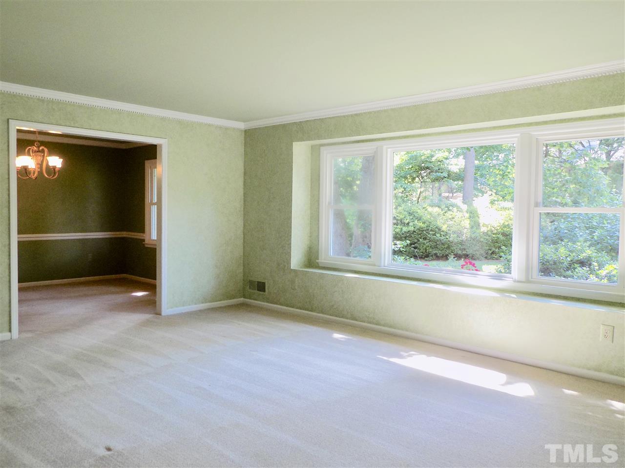 1115 Hunting Ridge Road Raleigh, NC 27615 - Photo 8 of 25 an empty room with entrance and windows