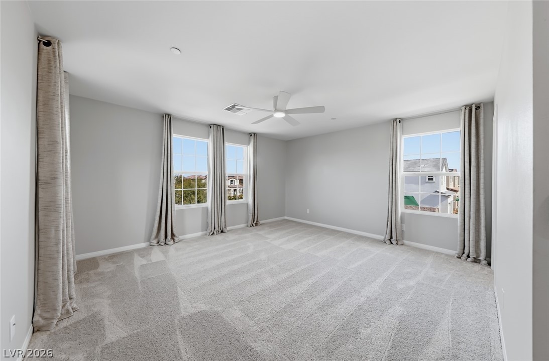 3564 Credere Lane Henderson, NV 89074 - Photo 18 of 40 Unfurnished room with ceiling fan and light carpet