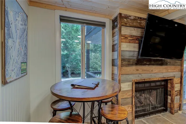 a kitchen with furniture and a fireplace