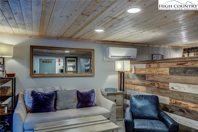 a kitchen with stainless steel appliances kitchen island granite countertop a refrigerator and a stove