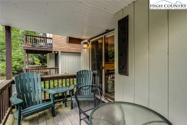 a view of a two chairs in the balcony