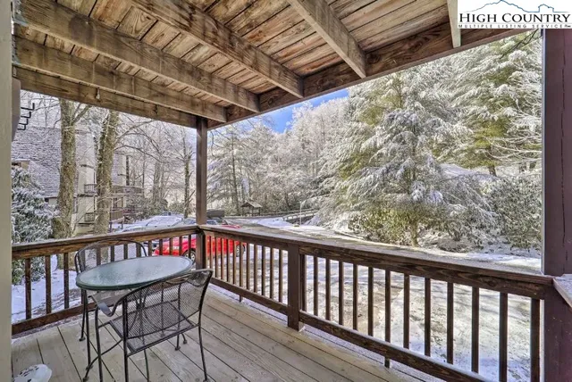 a hallway with a couch and dresser